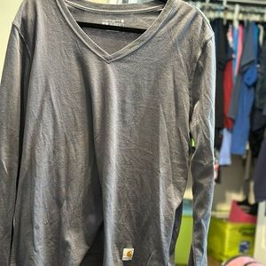 Women’s relaxed fit Gray long sleeve Carhartt shirt.